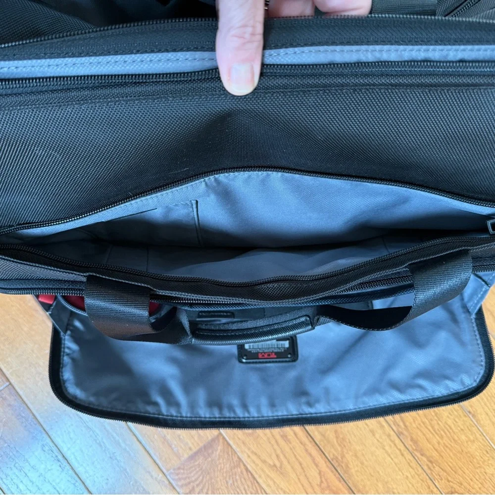 Tumi Black Duffel Bag with Adjustable Shoulder Strap